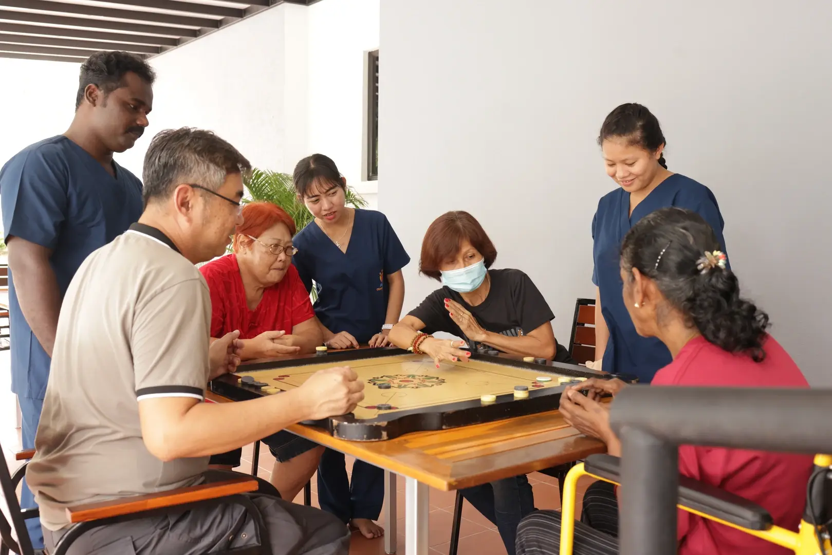 Background of an elderly patient with a nurse and a caregiver