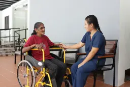 Hands of a nurse and an elderly patient